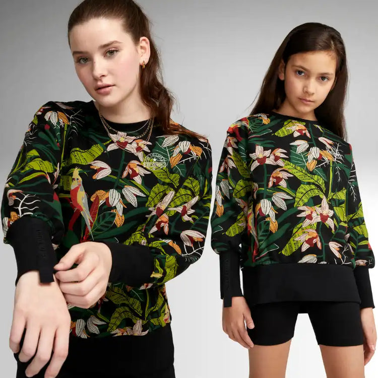 Sweatshirt à imprimé floral tropical avec des poignets et un ourlet en côte noir.